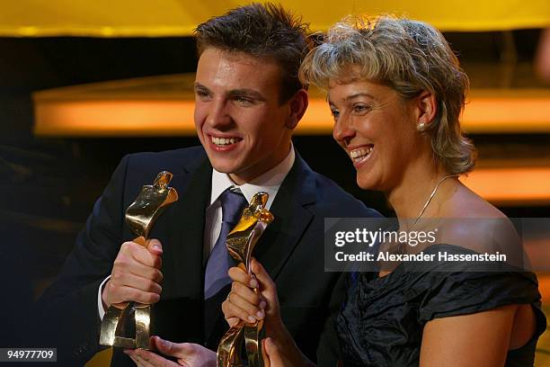 Paul Biedermann, winner of the 'Athlete of the Year' award poses with Steffi Nerius winner of the female 'Athlete of the Year' award after the...