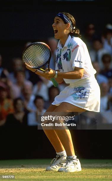 Conchita Martinez of Spain celebrates during the Lawn Tennis Championships at Wimbledon in London. \ Mandatory Credit: Bob Martin /Allsport