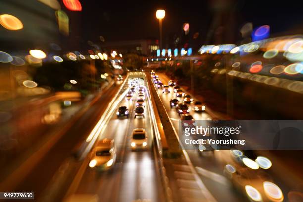 car traffic at night. motion blurred background.shanghai city,china - thruway stockfoto's en -beelden
