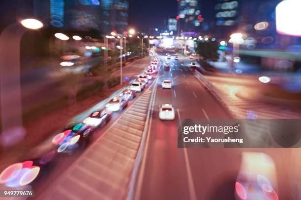 car traffic at night. motion blurred background.shanghai city,china - thruway - fotografias e filmes do acervo