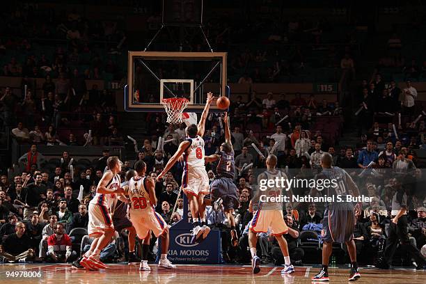 Danilo Gallinari of the New York Knicks blocks potential game winning shot against Acie Law of the Charlotte Bobcats on December 20, 2009 at Madison...