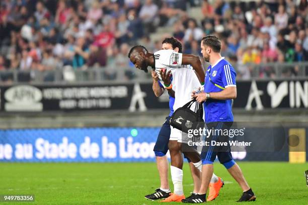 Lacina Traore of Amiens is injured during the Ligue 1 match between Amiens SC and Strasbourg at Stade de la Licorne on April 21, 2018 in Amiens, .