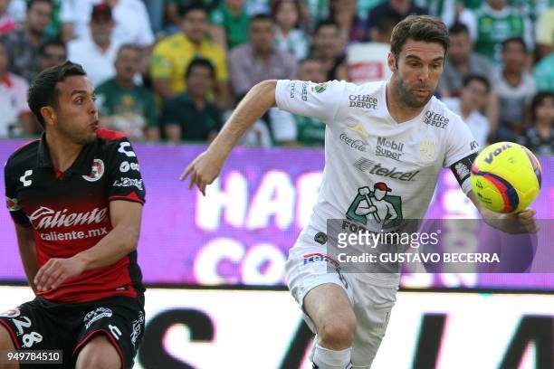 Leon's Argentine player Mauro Boselli vies for the ball with Tijuana's defender Omar Mendoza during their 2018 Mexican Clausura tournament football...