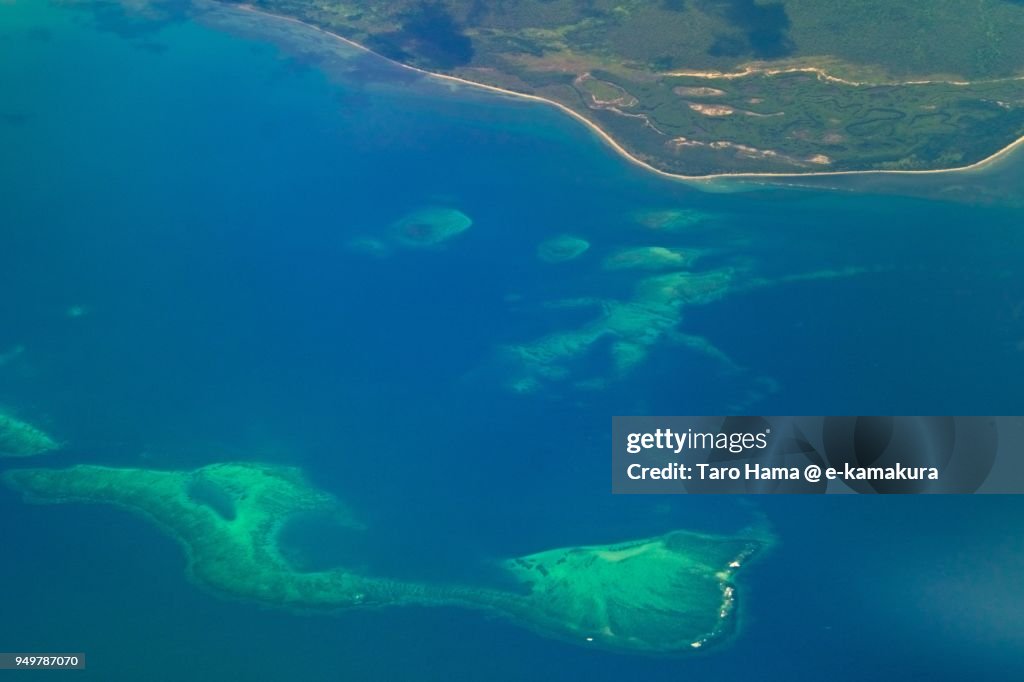Pacific Ocean and coral leaf in Central Province in Papua New Guinea daytime aerial view from airplane
