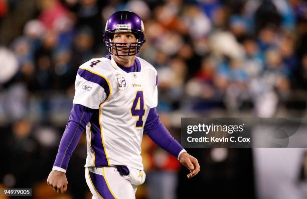 Quarterback Brett Favre of the Minnesota Vikings walks off the field after a turnover on downs to the Carolina Panthers at Bank of America Stadium on...