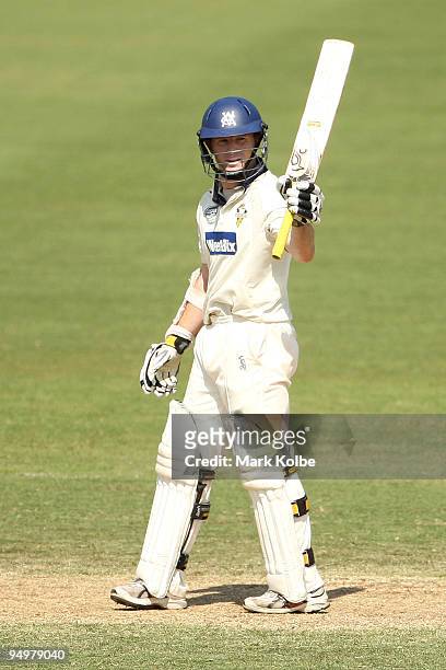 Chris Rogers of the Bushrangers celebrates scoring his half century during day four of the Sheffield Shield match between the New South Wales Blues...