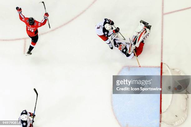 Washington Capitals center Nicklas Backstrom raises his arms after scoring the game winning goal in overtime against Columbus Blue Jackets goaltender...