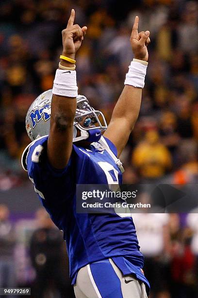 Dwight Dasher of the Middle Tennessee Blue Raiders celebrates after throwing a touchdown pass against the Southern Miss Golden Eagles during the R+L...