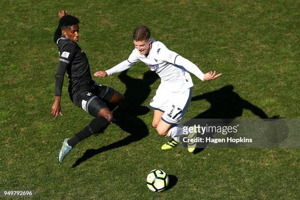 Reid Drake of Auckland City FC is tackled by Nathanael Hailemariam of Team Wellington during leg one of the OFC Champions League 2018 Semi-finals...