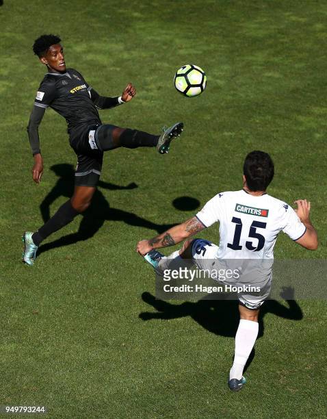 Nathanael Hailemariam of Team Wellington controls the ball under pressure from Dan Morgan of Auckland City FC during leg one of the OFC Champions...