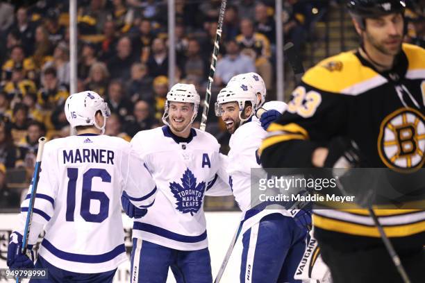 James van Riemsdyk of the Toronto Maple Leafs celebrates after scoring a goal with teammates Nazem Kadri, Tyler Bozak and Mitchell Marner as Zdeno...