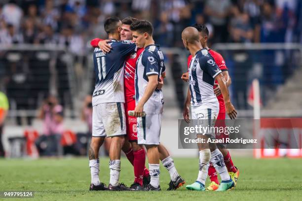 Players of Monterrey comfort players of Lobos after their team got relegated to second division at the end of the 16th round match between Monterrey...