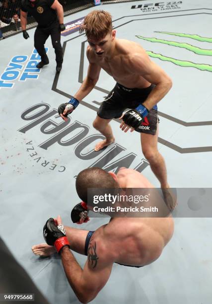 Dan Hooker of New Zealand knocks out Jim Miller in their lightweight fight during the UFC Fight Night event at the Boardwalk Hall on April 21, 2018...