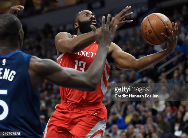 James Harden of the Houston Rockets shoots the ball against Gorgui Dieng of the Minnesota Timberwolves during the first quarter in Game Three of...