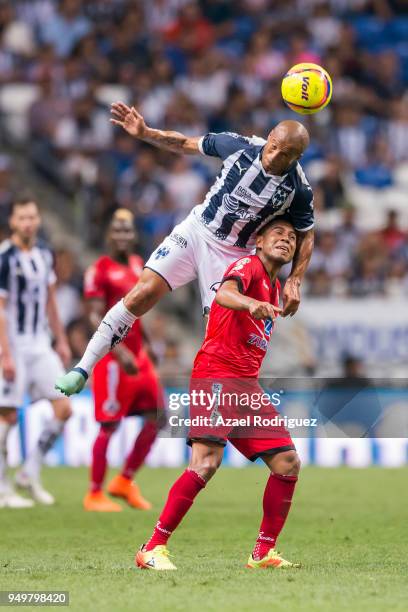 Carlos Sanchez of Monterrey heads the ball with Juan Carlos Medina of Lobos during the 16th round match between Monterrey and Lobos BUAP as part of...