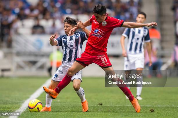 Misael Dominguez of Monterrey fights for the ball with Eduardo Tercero of Lobos during the 16th round match between Monterrey and Lobos BUAP as part...