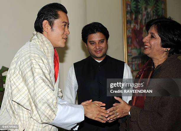 King of Bhutan Jigme Khesar Namgyel Wangchuck is greeted by Indian Foreign Secretary Nirupama Rao as Minister of State for Commerce and Industry...