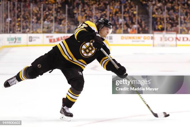 Torey Krug of the Boston Bruins takes a shot against the Toronto Maple Leafs during the third period of Game Five of the Eastern Conference First...