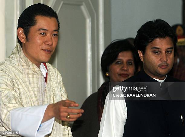 King of Bhutan Jigme Khesar Namgyel Wangchuck walks with Indian Foreign Secretary Nirupama Rao and Minister of State for Commerce and Industry...