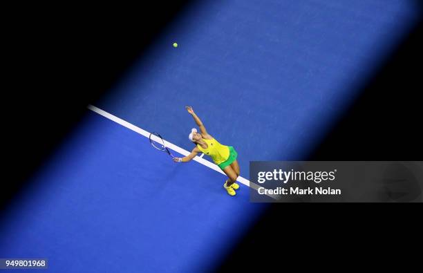 Ashleigh Barty of Australia serves in her match against Lesley Kerkhove of the Netherlands during the World Group Play-Off Fed Cup tie between...