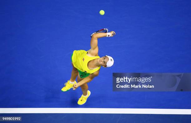 Ashleigh Barty of Australia serves in her match against Lesley Kerkhove of the Netherlands during the World Group Play-Off Fed Cup tie between...