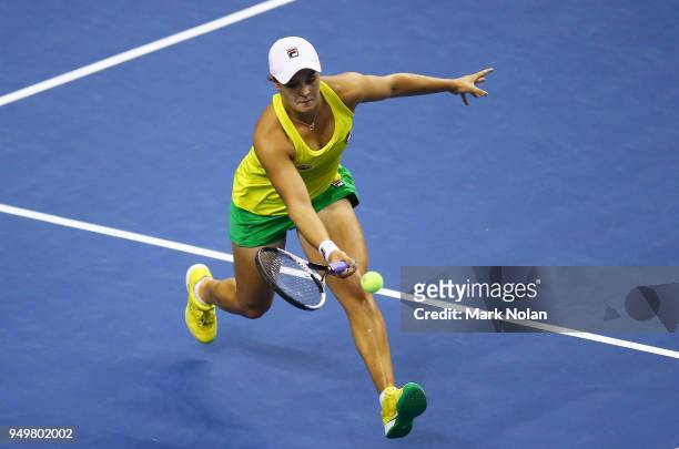 Ashleigh Barty of Australia plays a forehand in her match against Lesley Kerkhove of the Netherlands during the World Group Play-Off Fed Cup tie...