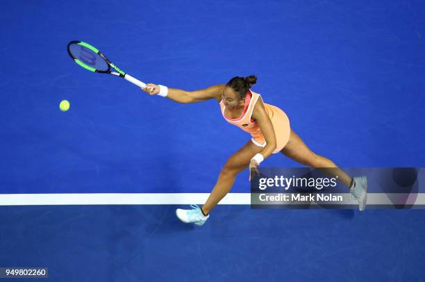 Lesley Kerkhove of the Netherlands plays a forehand in her match against Ashleigh Barty of Australia during the World Group Play-Off Fed Cup tie...