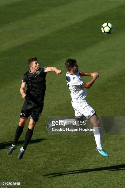 Scott Hilliar of Team Wellington and Kris Bright of Auckland City FC compete for a header during leg one of the OFC Champions League 2018 Semi-finals...