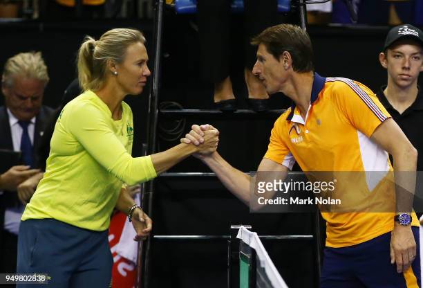 Australian captain Alicia Molik and Netherlands captain Paul Haarhuis shake hands after the match between Ashleigh Barty of Australia and Lesley...