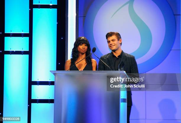 Monique Coleman and Garrett Clayton speak onstage during The Thirst Project's 9th Annual Thirst Gala at The Beverly Hills Hotel on April 21, 2018 in...