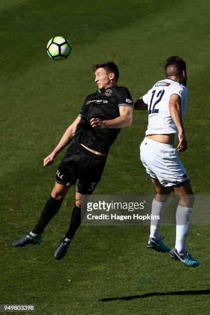 Scott Hilliar of Team Wellington and Kris Bright of Auckland City FC compete for a header during leg one of the OFC Champions League 2018 Semi-finals...