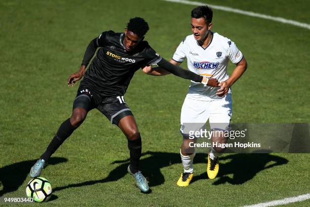 Nathanael Hailemariam of Team Wellington holds off the challenge of Cameron Howieson of Auckland City FC during leg one of the OFC Champions League...