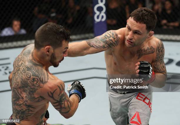 Frankie Edgar punches Cub Swanson in their featherweight fight during the UFC Fight Night event at the Boardwalk Hall on April 21, 2018 in Atlantic...