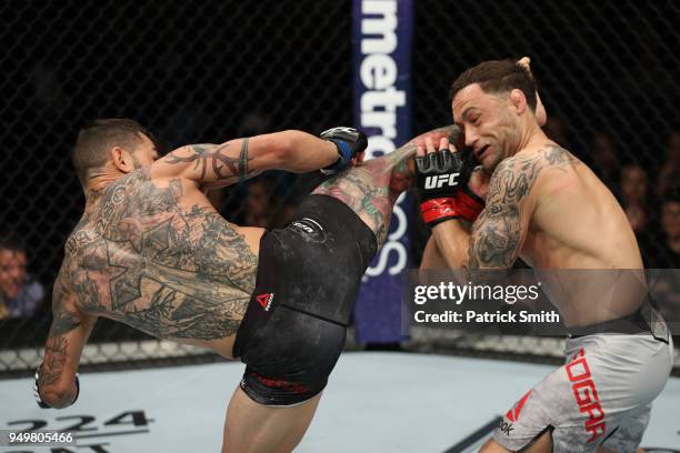 Cub Swanson kicks Frankie Edgar in their featherweight fight during the UFC Fight Night event at the Boardwalk Hall on April 21, 2018 in Atlantic...