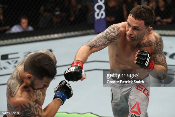 Frankie Edgar punches Cub Swanson in their featherweight fight during the UFC Fight Night event at the Boardwalk Hall on April 21, 2018 in Atlantic...