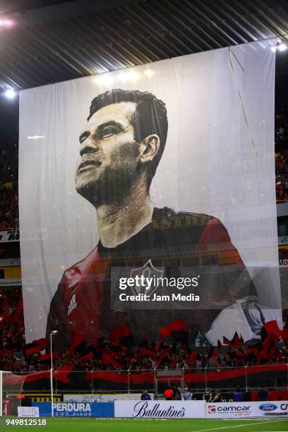 Fans of Atlas display a flag with a portrait of Rafael Marquez on the last match of his career during the 16th round match between Atlas and Chivas...