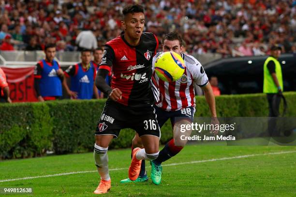 Ulises Cardona of Atlas and Alejandro Mayorga of Chivas compete for the ball during the 16th round match between Atlas and Chivas as part of the...