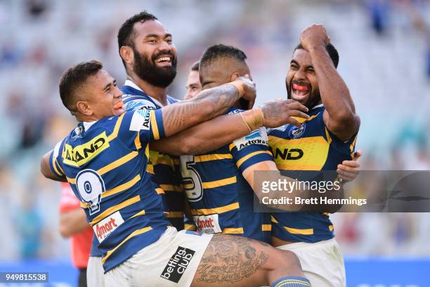 Michael Jennings of the Eels celebrates scoring a try with team mates during the round seven NRL match between the Parramatta Eels and the Manly Sea...