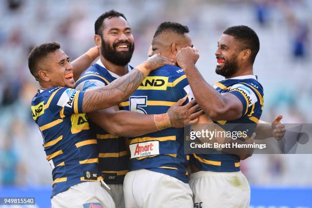 Michael Jennings of the Eels celebrates scoring a try with team mates during the round seven NRL match between the Parramatta Eels and the Manly Sea...