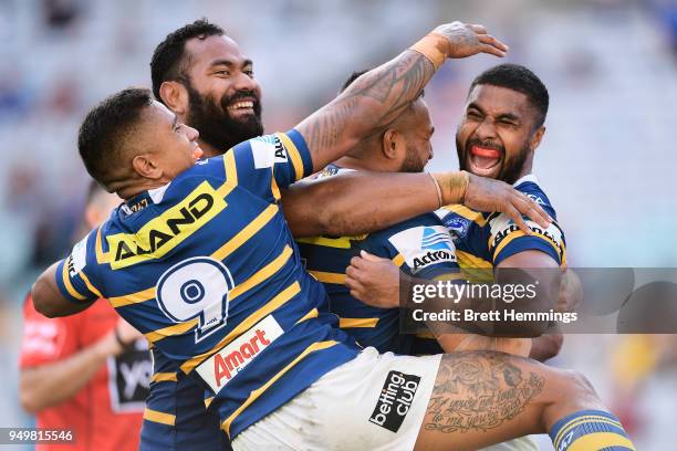 Michael Jennings of the Eels celebrates scoring a try with team mates during the round seven NRL match between the Parramatta Eels and the Manly Sea...