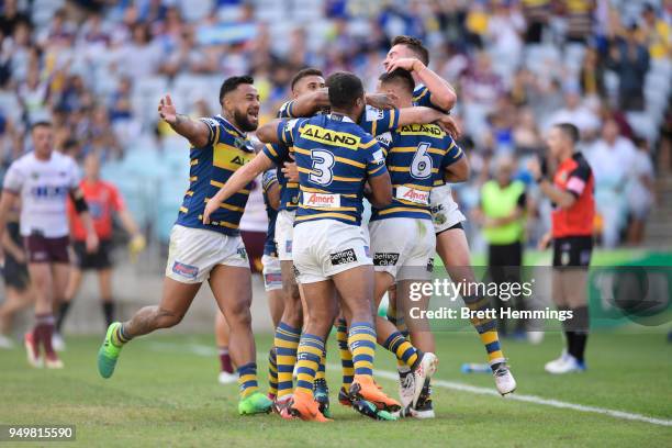 Corey Norman of the Eels celebrates scoring a try with team mates during the round seven NRL match between the Parramatta Eels and the Manly Sea...