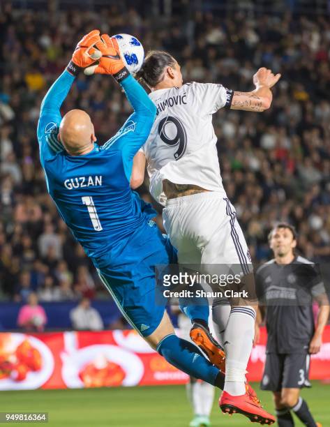 Zlatan Ibrahimovic of Los Angeles Galaxy battles Brad Guzan of Atlanta United during the Los Angeles Galaxy's MLS match against Atlanta United FC at...