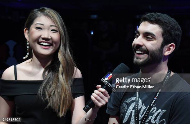 Esports host Sue Lee interviews gamer Maurilio "Blind" Gramajo of California after he won his second straight match of "Fortnite" while playing...