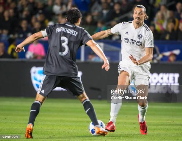 Zlatan Ibrahimovic of Los Angeles Galaxy takes on Michael Parkhurst of Atlanta United during the Los Angeles Galaxy's MLS match against Atlanta...