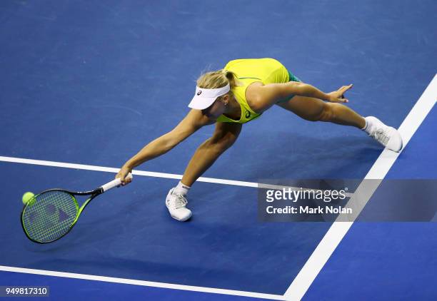 Daria Gavrilova of Australia plays a backhand in her match against Quirine Lemoine of the Netherlands during the World Group Play-Off Fed Cup tie...