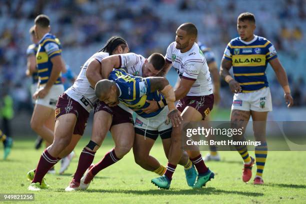 Manu Ma'u of the Eels is tackled during the round seven NRL match between the Parramatta Eels and the Manly Sea Eagles at ANZ Stadium on April 22,...