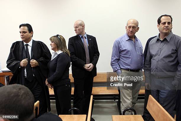 Former Bureau Chief Shula Zaken and former Israeli Prime Minister Ehud Olmert arrive at the District Court on December 21, 2009 in Jerusalem, Israel....