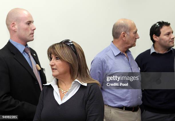 Former Bureau Chief Shula Zaken and former Israeli Prime Minister Ehud Olmert arrive at the District Court on December 21, 2009 in Jerusalem, Israel....