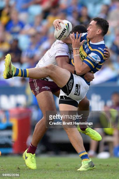 Bradley Takairangi of the Eels is tackled during the round seven NRL match between the Parramatta Eels and the Manly Sea Eagles at ANZ Stadium on...