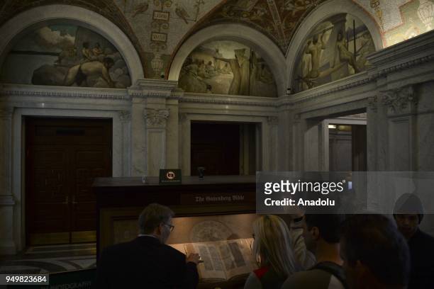 Photo taken on March 27, 2018 shows visitors viewing The Gutenberg Bible at the Library of Congress within the "World Book Day" in Washington, United...